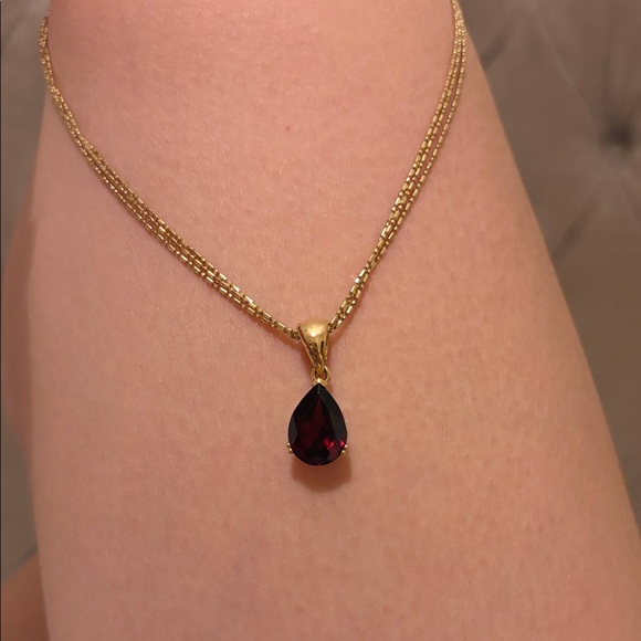 Elegant Gold Necklace with Red Teardrop Pendant